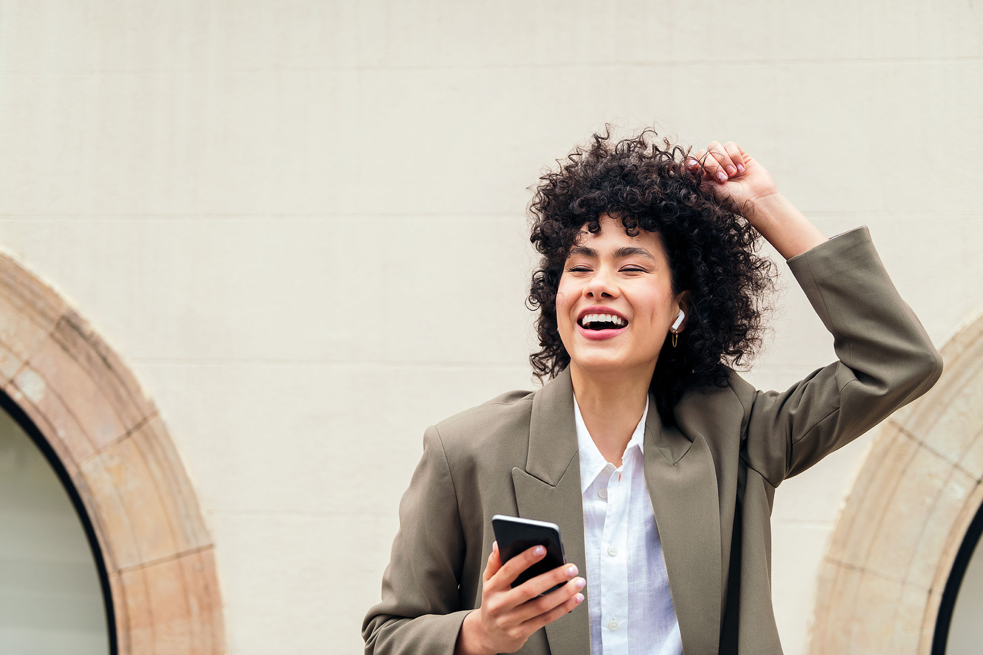 happy-woman-with-earphones-dancing-with-the-music-2022-11-18-09-56-51-utc.jpg